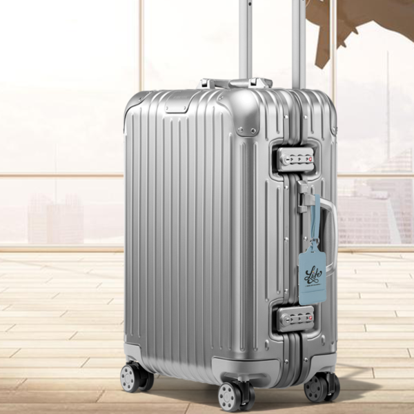 alt="luggage tags on suitcase"